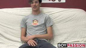 Adorable gay guy Danny jerks off his dick on couch solo