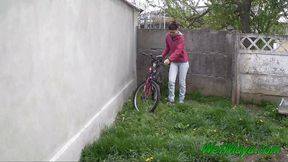 Pissing in the backyard on a cold day, and leaving on her bike