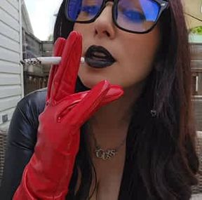 Real smoking girl in black latex and black lips