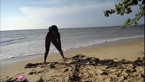 Juicy ebony honeys gettin' their booty on the sandy shore, gotta cum!