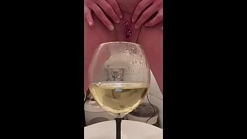 Pee in the Glass and pouring pee over myself and my big tits and little tease pee from my nipples