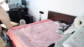 An amateur woman has fun trying on clothes that she cuts