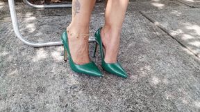 Beautiful stiletto heels dangle from a lady's feet (3)