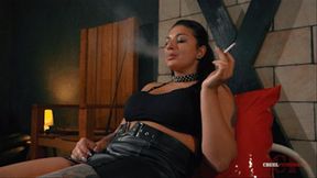 Mistress Darkness smokes on the metal bed FHD MP4