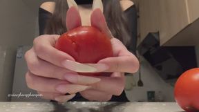 Destroying tomato with my long nails