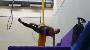 practicing hip locks on the aerial silks