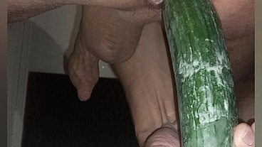 One handsome man and one cucumber
