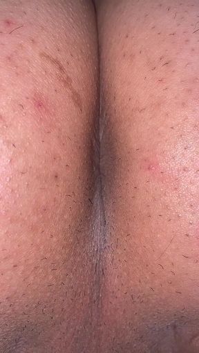A man exposes his asshole. Take a close-up shot so you can see the wrinkles clearly
