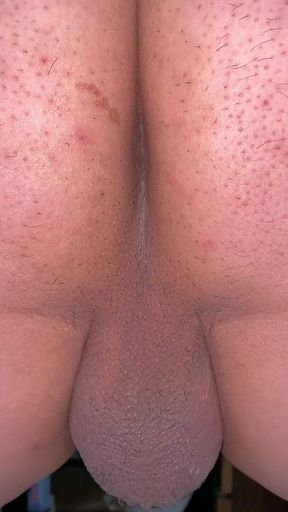 A man exposes his asshole. Take a close-up shot so you can see the wrinkles clearly