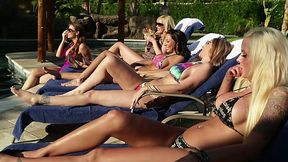 Several sex-hungry babes fuck each others cunts by the poolside