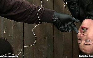 Brunette in upside down bondage