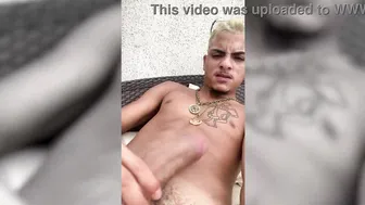 Teen twink jerks off his big cock on mansion porch