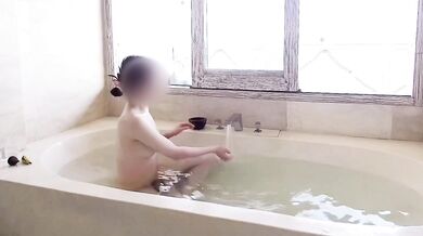 Older man worships his young wife in the resort bath
