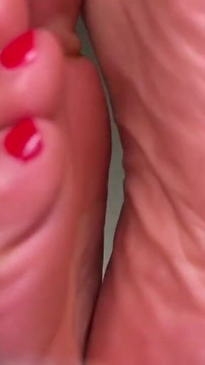 Pink Foxx Takes off Shoes After a Long Day