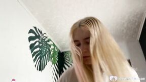 Blonde chick is on her knees & giving a blowjob