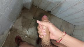 Latino urinating and masturbating his large penis until he ejaculates