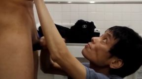 Japanese gay helping friend to cum in the public bathroom