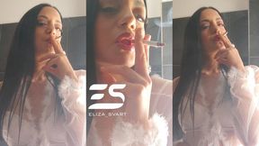 Smoking in a bra and white see through robe