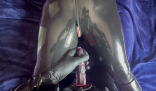 Latex catsuit, strap-on penis sex.