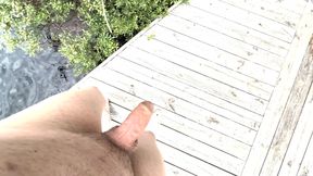 Teen chills completely naked by the lake