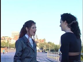 Redhead and brunette babes at the outdoors interview