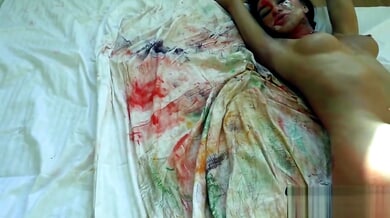 Katrin Tequila's painted body glistens as she explores herself in close-up