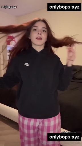 Woman in pajamas with hair blowing in the wind