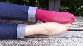 ”Former playmate Diana takes off her shoes & socks in a public park, then relaxes on a bench showin”