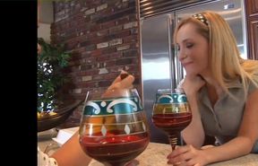 Two blondes explore their bodies in the kitchen