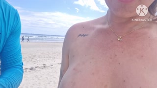 Wife goes topless on public beach and gets blowjob from a stranger
