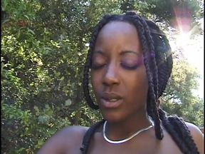 Three amazing ebony chicks are doing each other's pussies with dildos outdoors