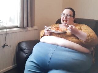SSBBW giant abdomen during the time that eating on sofa