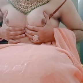 Indian Gay Crossdresser Gaurisissy pressing her big boobs and fingering in her clean shaved big ass in red saree