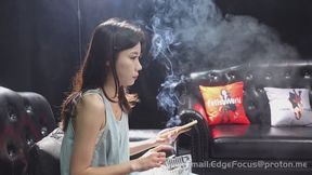 Asian Woman Exhaling Thick Cigarette Smoke Clouds on Leather Couch HD
