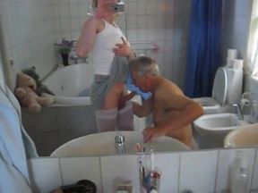 crosdresser having a blowjob by an old guy