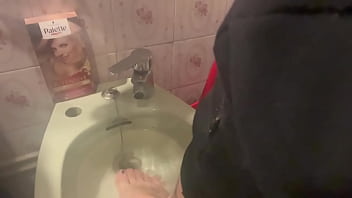 Rebeca Adams' dirty feet in the laundry room