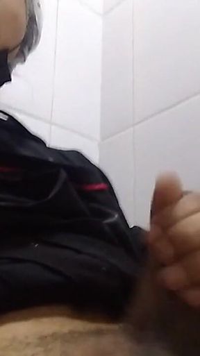 Man Sits in the Bathroom
