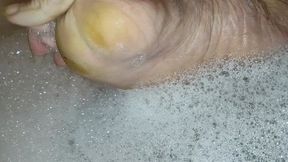 Tempest in bubble bath and showing feet