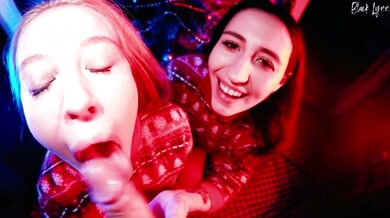 Pink and red-haired women share a man during a heated holiday threesome
