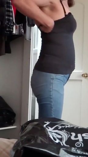 My stepmother tries on jeans while I masturbate, admiring her big ass and hairy pussy.   Clip 1