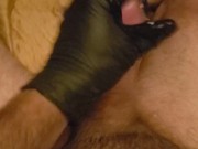 Close up glove stroke cum shot