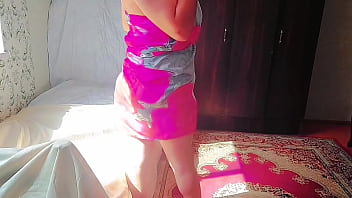 Sweet shemale hugging pillow tightly while smiling shyly