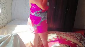 Sweet shemale hugging pillow tightly while smiling shyly