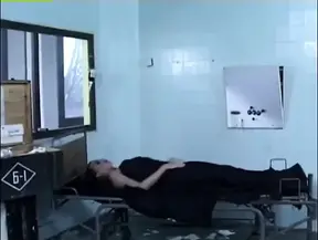 Evil nurse takes control in a hot and steamy scene.