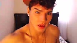 Lating Twink with Hat on Strokign Cock on Bed