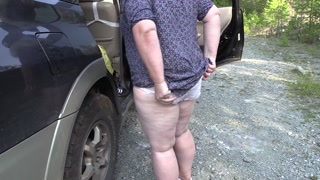 Mature bbw milf with huge saggy tits changes clothes outdoors near the car