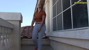 red august pee pee dancing and wetting herself on balcony