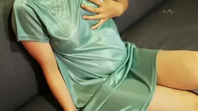 Indonesian stepmom enjoys casual couch session in see-through satin dress
