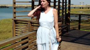 Redhead flashes public pussy in risky street tease