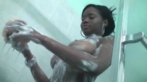 Leggy black chick with big breasts gets wet and soapy in shower at hotel